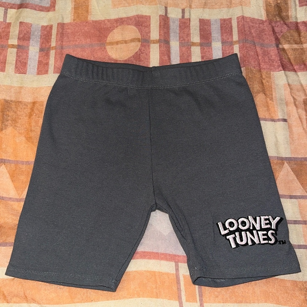 Women’s bike shorts size XS. Looney Tunes printed on one side of the shorts.